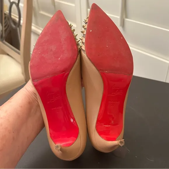 A authentic Christian Louboutin taupe pumps with gold studs
