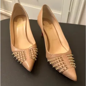 A authentic Christian Louboutin taupe pumps with gold studs