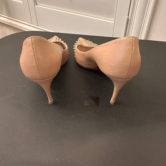 A authentic Christian Louboutin taupe pumps with gold studs