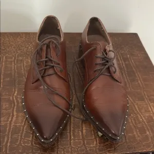 Leather Stitching feel little small feels like 7 original. Ecuadorian designer