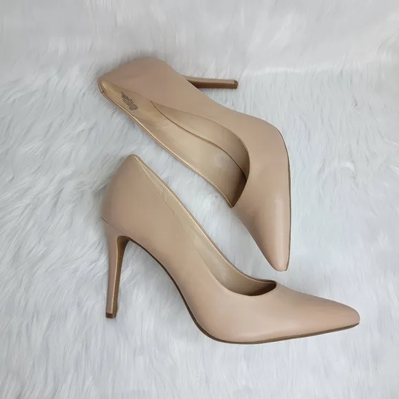 Nine West nude pointed toe stiletto heels.