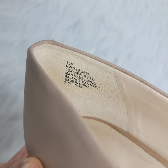Nine West nude pointed toe stiletto heels.