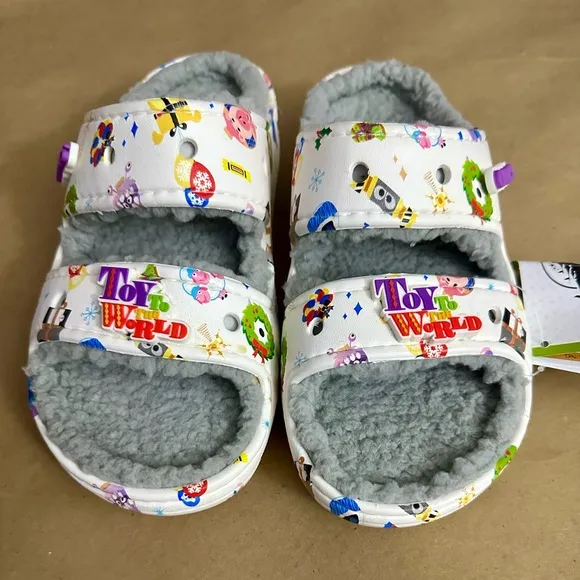 NWT Crocs Disney Parks Holiday Pixar Toy To The World White Slides Sandals