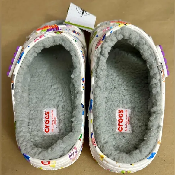 NWT Crocs Disney Parks Holiday Pixar Toy To The World White Slides Sandals