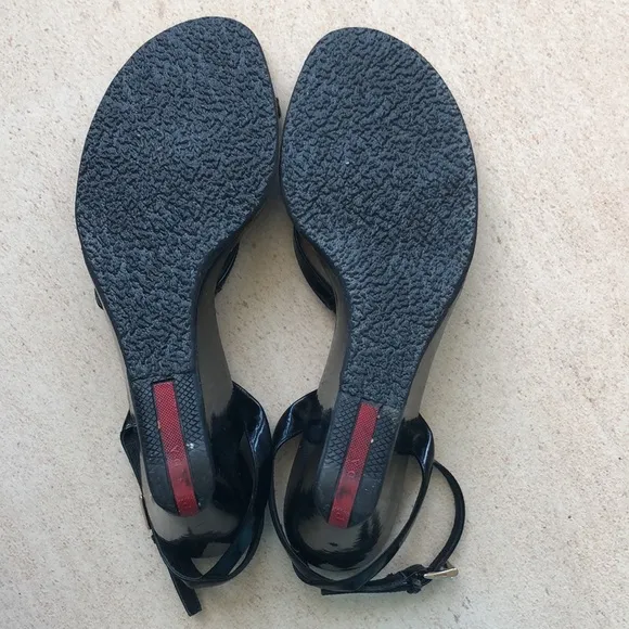 Prada patent leather sandals.