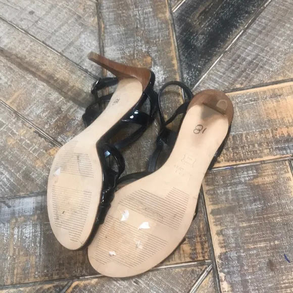 Stuart Weizmann patent leather strappy heels.