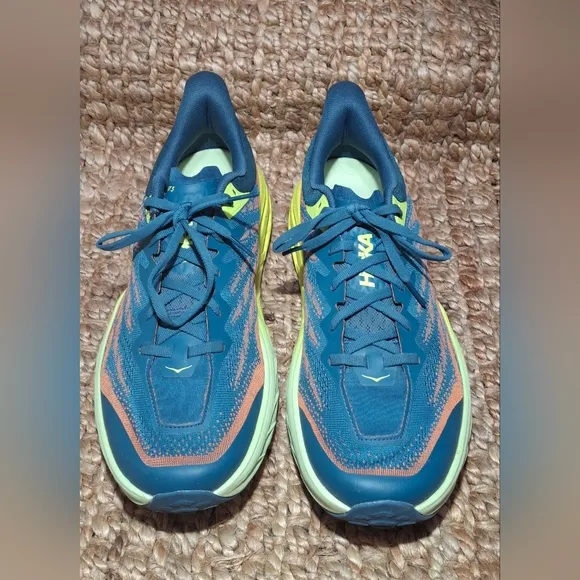 The HOKA Speedgoat 5 is a highly cushioned, technical trail running shoe designe