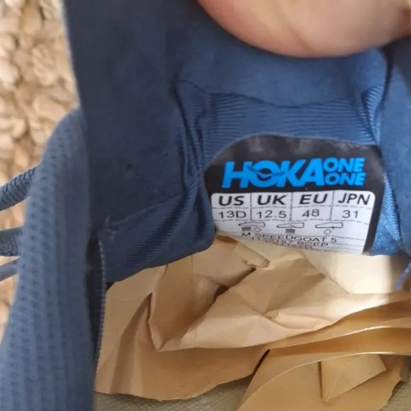 The HOKA Speedgoat 5 is a highly cushioned, technical trail running shoe designe