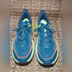 The HOKA Speedgoat 5 is a highly cushioned, technical trail running shoe designe