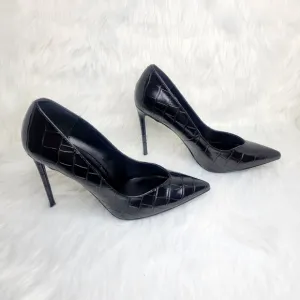 Winnie Harlow pointed toe black stiletto heels.